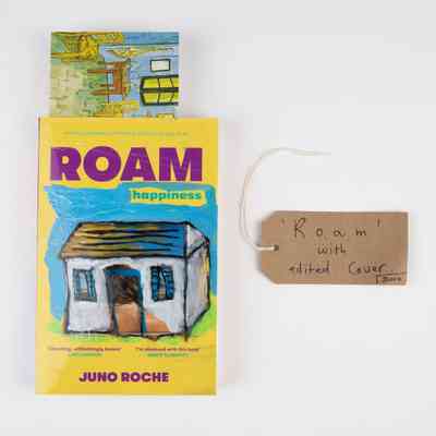 The image shows a book titled "Roam" with an edited cover featuring a small house illustration.