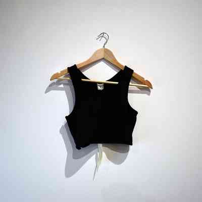 A black binder hung on a wooden hanger.