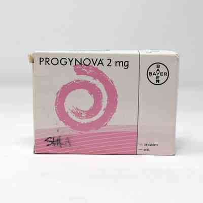 A box of Progynova 2 mg. The box is white with a pink swirl. The donor's name, Shika, has been written in pen in the bottom left corner. This text has smudged.