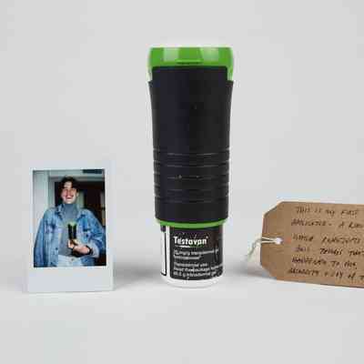 A Testavan applicator with a polaroid of the owner and a brown handwritten luggage tag.