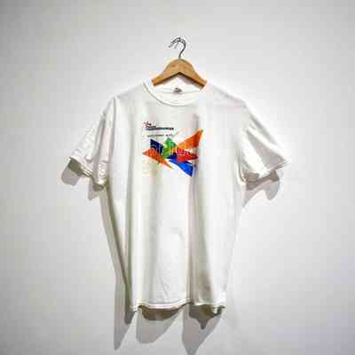 A white t-shirt on a wooden hanger with a colourful logo and txt "#WEARE NORTHERNPRIDE" "volunteer with pride".