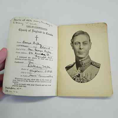 Front page of booklet, with card of commendation and portrait depicting King George VI.