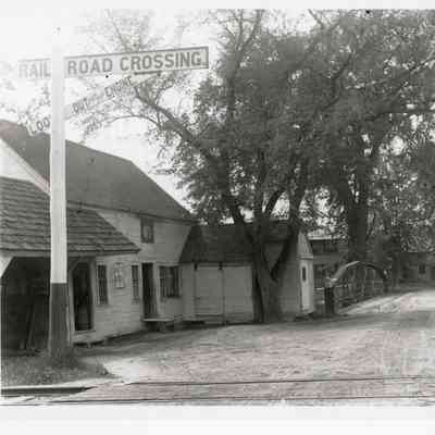 View of Railroad Crossing, Bridge, and Buildings