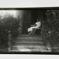 Young Woman with Cat and Dog on Porch