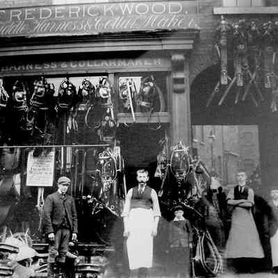 The Woods shop late 1890s to early 1900s. Picture posted with kind permission of Fred Wood's niece: From left to right: unknown employee, Frederick Wood senior the original saddler, Freddie Wood son of Frederick's deceased son,  Frederick William Wood the surviving son of Frederick Wood senior, unknown apprentice saddler.  The saddlers wore aprons.
