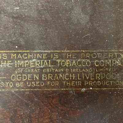 Label on the rear of the dispenser stating the machine is theproperty of the Imperial Tobacco Co.,