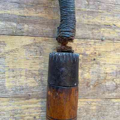 Detail of junction of the end of handle and the rope to attach the ball