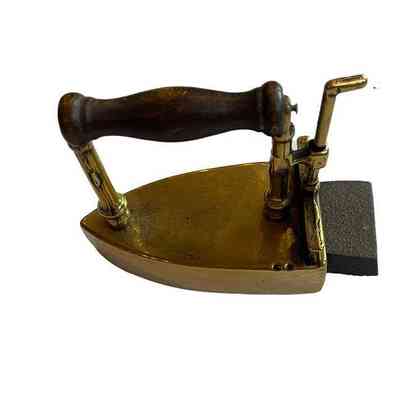 Brass iron showing heating stone inserted and lever