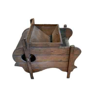 View of back of hand operated winnowing machine