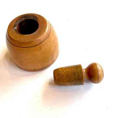Wooden pestle and mortar apart