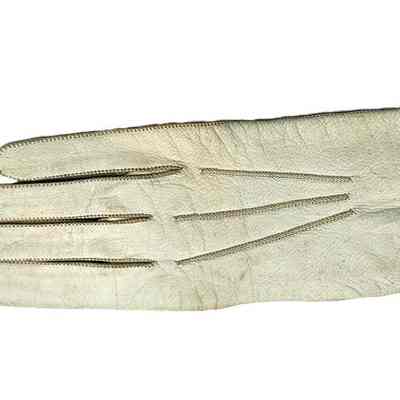 Single white children's glove show detailed stitching on the back