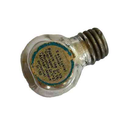 Small glass bottle of silvred pills - back, listing ingredients