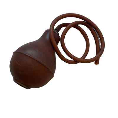 The rubber sphere (puffer) and rubber tube of the tailor's puffer.