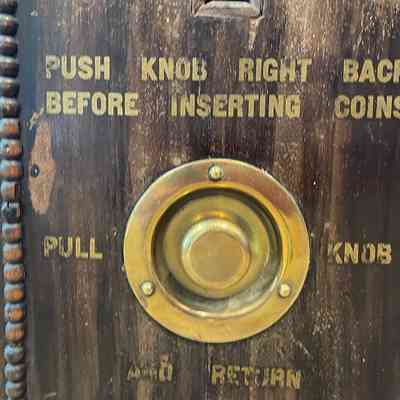 Instructions on front of cigarette dispenser