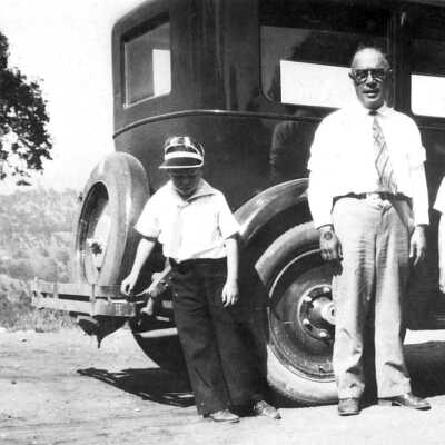Dr. Manuel Fernandez Family: Dr. Manuel Fernandez and family outside an automobile.
