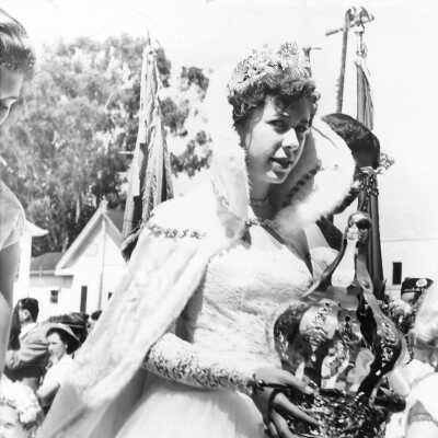 Queen Deanna Faria 1954: Queen Deanna Faria is holding her crown and septar at the Holy Ghost Festival