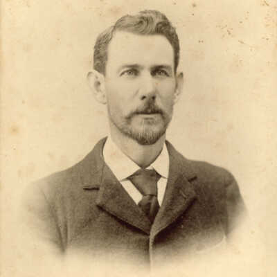 Dr. John Tennent, Samuel's son (Bill McMaster): Portrait of Dr. John Tennent wearing a suit and tie