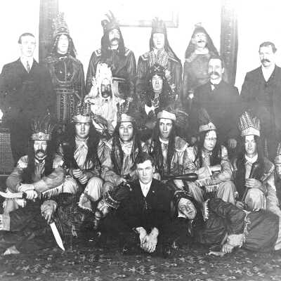 Shenandoah #121 #4 (Mariotti): Taken in Old Hall, Pinole. Tom Bennett (Marilyn's uncle) is second from left in top row. Frank Bennett (Marilyn's father) is second from right in first row seated. William O'Kerland (Marilyn's grandfather), is on the floor, legs extended.