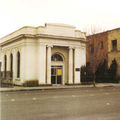 Bank of Pinole and the Downer Building, which once housed the medical offices of Dr. Manuel Fernandez and Greenstein's Pharmacy, 1980s. The Downer Building was damaged in the 1989 Loma Prieta earthquake and was demolished. (Clyde Maskal)