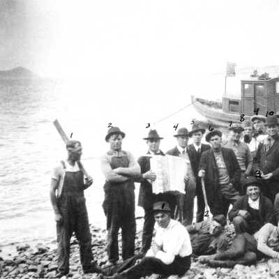Pinole Outing and Athletic Club at Red Rock (Castro): Some of the Pinoleans on this excursion were (seated): George Pfeiffer (6), and, at the far right leaning his head on his hand, T. W. Woy; (standing): Manuel Marcos (2), Vince Scanlon (5), Molly Rose (6), Bill Lewis (7), and Jerry McDonald (10).