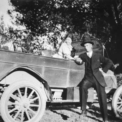 Theodore and Mary Woy and truck (10895) CCCHS: Theodore and Mary Woy pose for photograph on an early 1900s delivery truck.