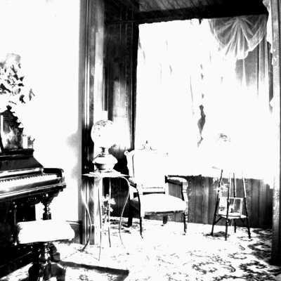 Ellerhorst house parlor (Mariotti): The Ellerhorst house parlor showing a piano, chair and other furniture decorating room.