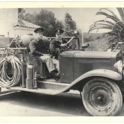 Firemen Driving Fire Truck