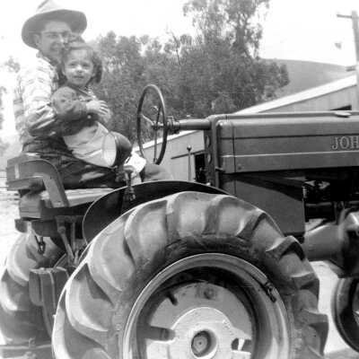 SIMAS Tony Jr. on Tractor with cousin early '50s #1 (Mary Simas): Tony Simas Jr. with a young cousin in the early 1950s on a John Deere tractor.