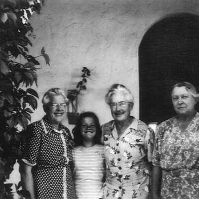 Ellerhorst sisters with Mary Butler 1946 (Mary Butler): Three of the five Ellerhorst sisters with Mary Butler in 1946 in front of arched doorway.