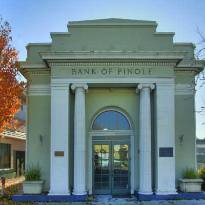 Bank of Pinole COLOR (Neptune): This building, photgraphed by Larry Neptune, is one of two in Pinole on the
National Register of Historic Places; the Fernandez Mansion is the other. In recent years it has
served as a pre-school, youth center, restaurant, and flower shop.