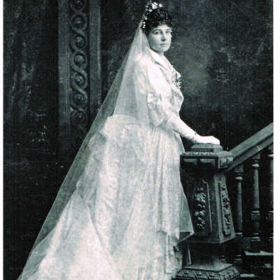 Louise Tennent in wedding dress, 1880 (Treadway): Portrait of James Tennent's bride, Louise wearing her wedding dress posing by a staircase