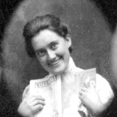Cameo of Ellerhorst daughter #3 (Mariotti): Portrait of Christina and C. H. Ellerhorst's daughter smiling holding a Vanity Fair magazine.
