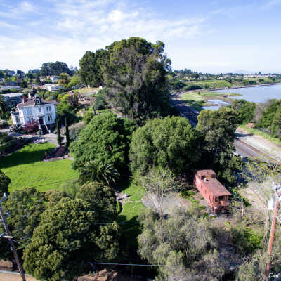 Fernandez Mansion from drone 12.2 MB 4-4-17 (Earl Combs): Earl Combs' drone photograph of the Fernandez Mansion and railroad along the bay.