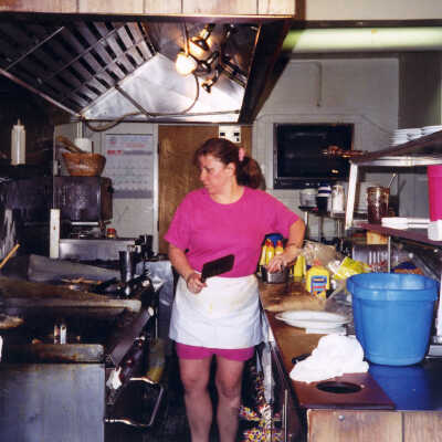 Cori Clark cooking in Alley Cafe OLD (color) 2