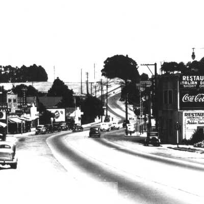 The Joe Lunghi Trovatore Cafe served Italian meals on the southwest corner of Tennent and San Pablo avenues, in this photo looking east toward Hercules.: On Main Street, east looking toward Hercules circa 1930. 