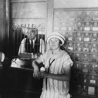 Patrons inside old post office-Maybele Fraser, George Fraser, postmaster, and Ruth Van Dollen, 9:10:28 (Armstrong)