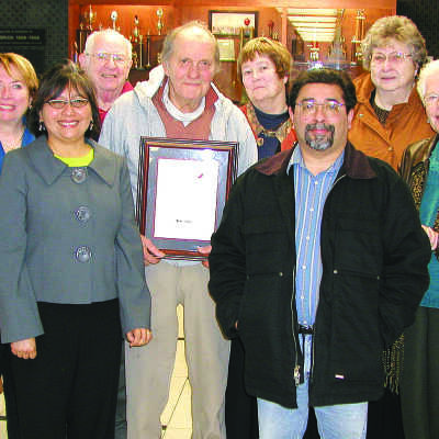 Group photo with Jo Ann: Group photo with Joe Mariotti holding his commemorative plaque from the Historical Landmarks Advisory Committee with Jo Ann and Norma Rubin to his right. 