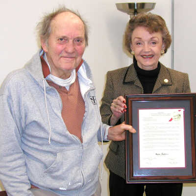 Joe Mariotti and Gayle Uilkema: Joe Mariotti and Gayle Uilkema hold Mr. Mariotti's plaque from the Historical Landmarks Advisory Committee. 