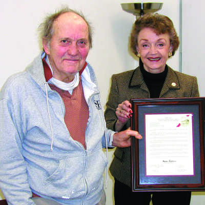 Joe Mariotti and Gayle Uilkema: Joe Mariotti and Gayle Uilkema hold Mr. Mariotti's plaque from the Historical Landmarks Advisory Committee. 