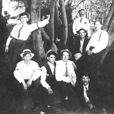 Men in Grove with Hats