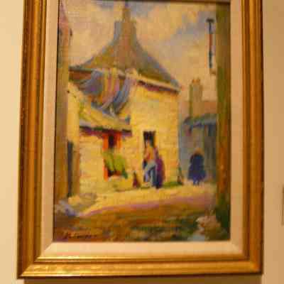 Man Entering Stone House