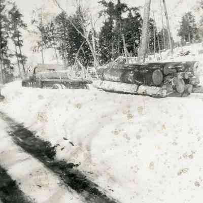 Logs and Trucks on the Winter Road