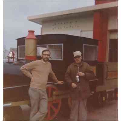Two Men in Front of Locomotive Float