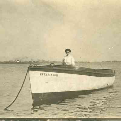 Photograph of Flora Baillie Souter sitting in "Pathfinder" boat