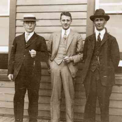 3 Men in front of Cache Bay Station
