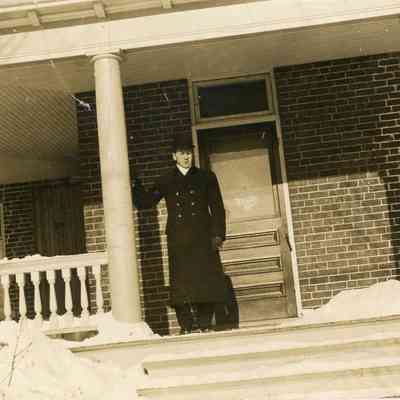 Photograph of Man on Porch