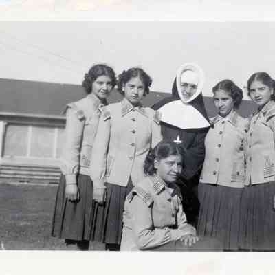 Dionne Quintuplets with One of Sisters of St. Joseph