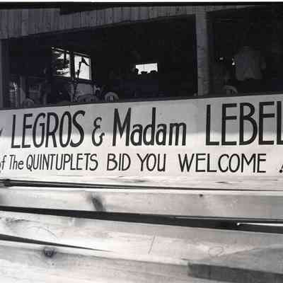 "Madam Legros and Madam Lebel: Midwives of the Quintuplets Bid You Welcome" Sign