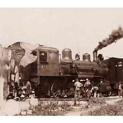 Men Grouped Outside of Locomotive
