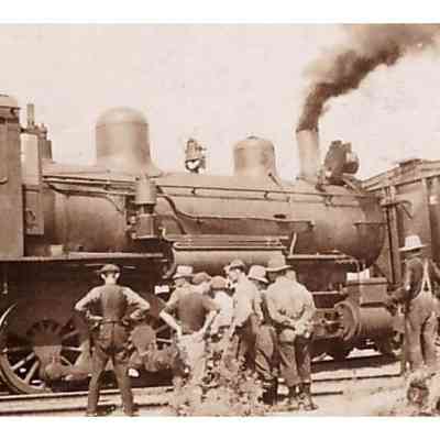 Men Grouped Outside of Locomotive